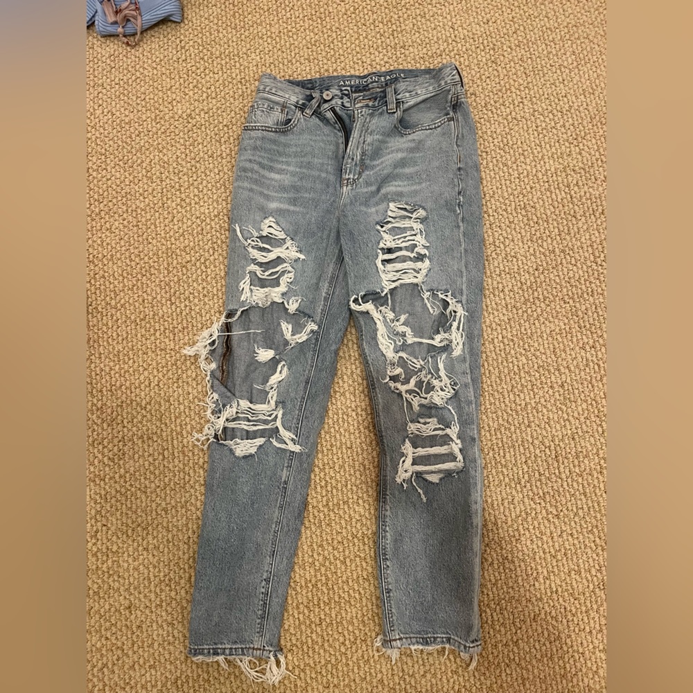 Very ripped blue mom jeans